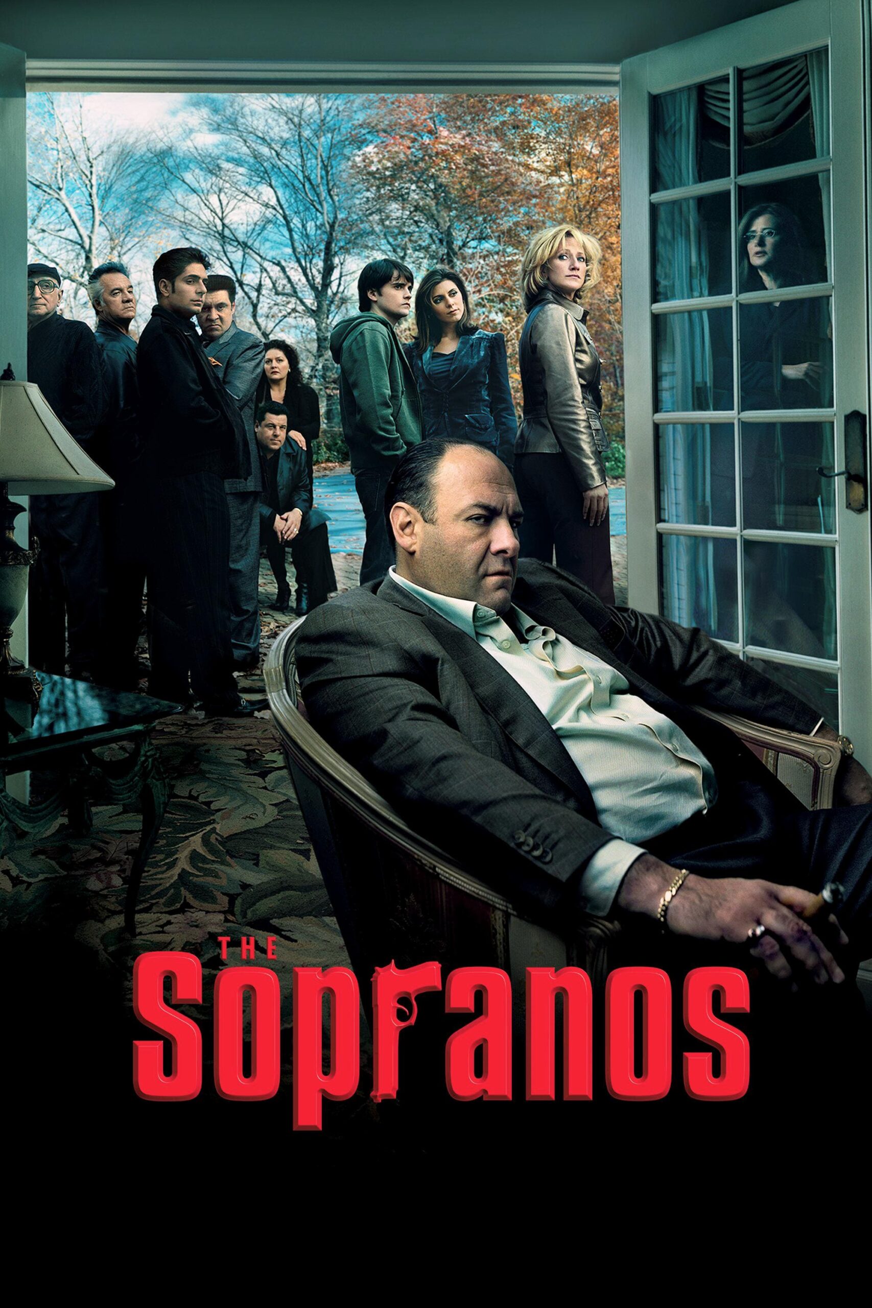 A man sits in an armchair inside a room, looking serious, while a group of people stands outside near open glass doors; The Sopranos title is at the bottom, evoking the intense atmosphere often explored on Brasil IPTV.